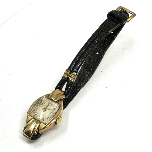 388 - Vintage 9ct gold ladies rolex tudor wristwatch with black leather strap the watch winds and ticks