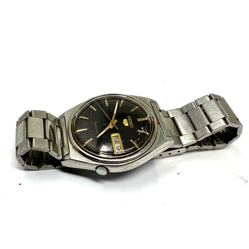 409 - Vintage Seiko 5 Automatic Day & Date 7009 -3140 the watch is ticking black dial