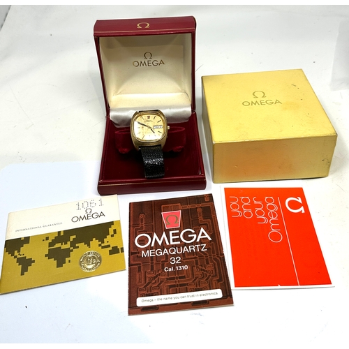 422 - Boxed Omega megaquartz 32 cal1310 box and papers the watch is not ticking possibly needs new battery