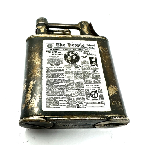 576 - Silver lift arm cigarette lighter with the enamel the people news paper