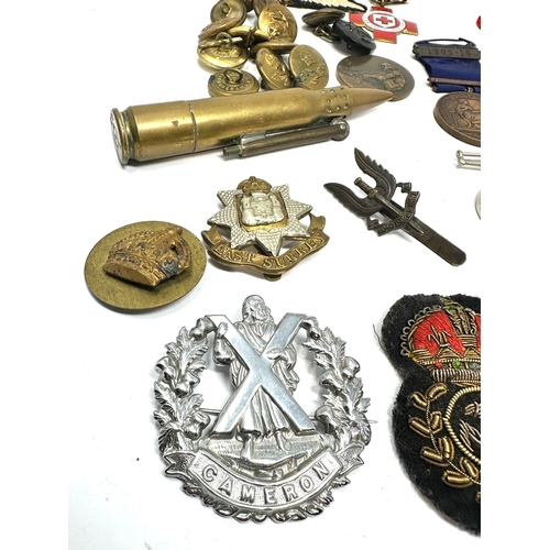 473 - selection of military items inc bullet lighter cap badges buttons patches etc