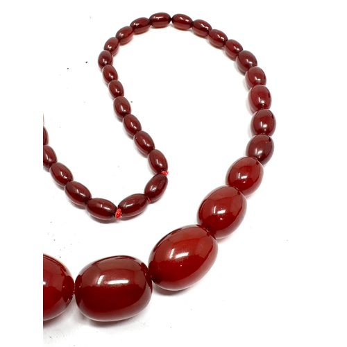 96 - Antique cherry amber / bakelite bead necklace weight 63g good internal streaking