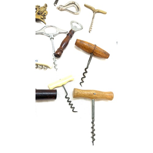 42 - Selection of vintage and later cork screws in a display case/ drawer