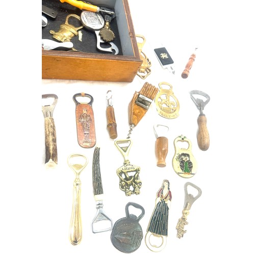 33 - Large selection of vintage Novelty bottle openers in a display case/ drawer