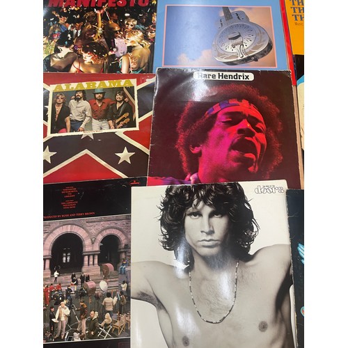 92 - Selection of assorted record includes Eagles, Rolling stones, the doors etc