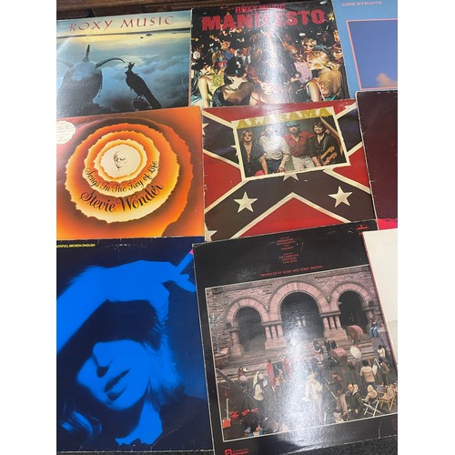 92 - Selection of assorted record includes Eagles, Rolling stones, the doors etc