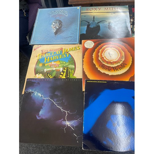 92 - Selection of assorted record includes Eagles, Rolling stones, the doors etc