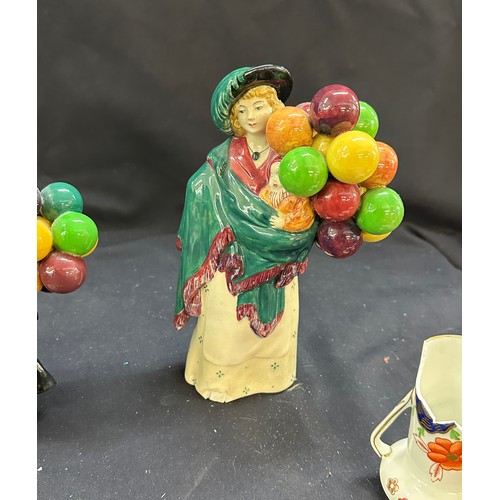 15 - Two vintage Royal Doulton figures ' The Balloon Man' and ' The Balloon seller', along with two Shell... 