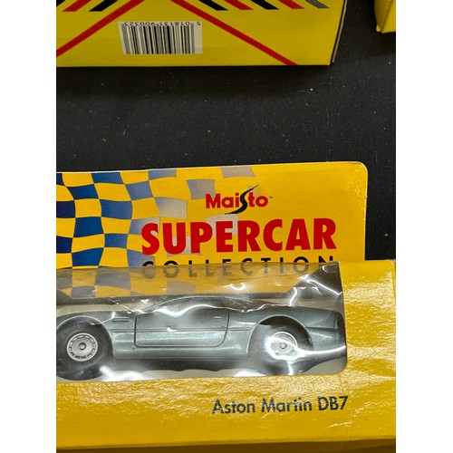 88 - Selection of boxed Maisto cars includes jaguar etc