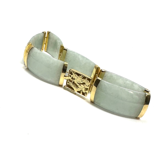 97 - Chinese 14ct gold & jade bracelet jade panels with 14ct gold mounts clasp has dragen details weight ... 