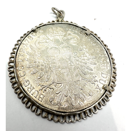 395 - silver M Theresiad silver coin in silver frame pendant mount weight 34g