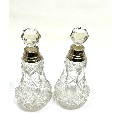 10 - Pair of antique hallmarked silver mounted perfume bottles each measure approx height 14cm london sil... 