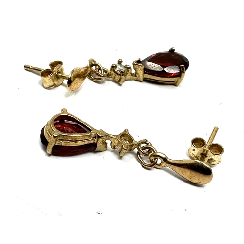 124 - 9ct gold garnet earrings weight 1.2g