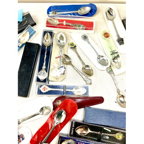 28 - Selection of assorted souvenir spoons and EPNS sugar tongs