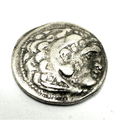 398 - Silver drachm coin minted by Alexander the Great (336-323 BC). Obverse: Alexander as Herakles wearin... 