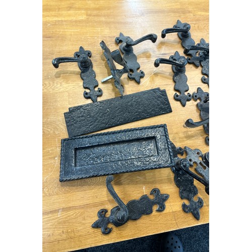 279 - Selection of vintage cast door handles, hinges, letter box etc