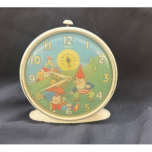 574 - Vintage enamel Smiths Noddy alarm clock in working order measures approx 5 inches tall