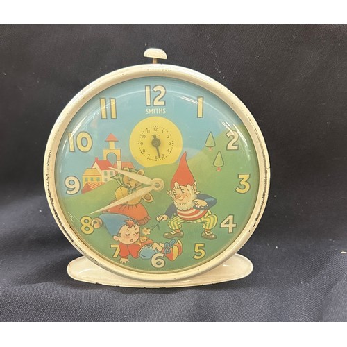 574 - Vintage enamel Smiths Noddy alarm clock in working order measures approx 5 inches tall