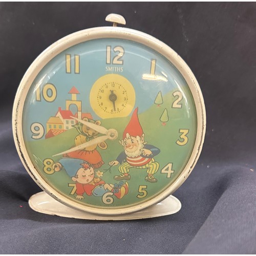 574 - Vintage enamel Smiths Noddy alarm clock in working order measures approx 5 inches tall