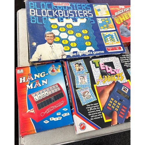 325 - Selection of vintage board games to include trivia pursuit, block busters, hang man etc