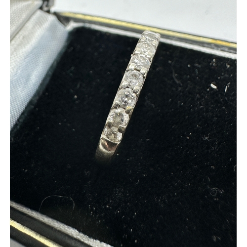 142 - 9ct white gold diamond half eternity ring weight 1.8g