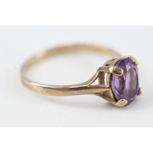 228 - 9ct gold pruple gemstone ring (2g)