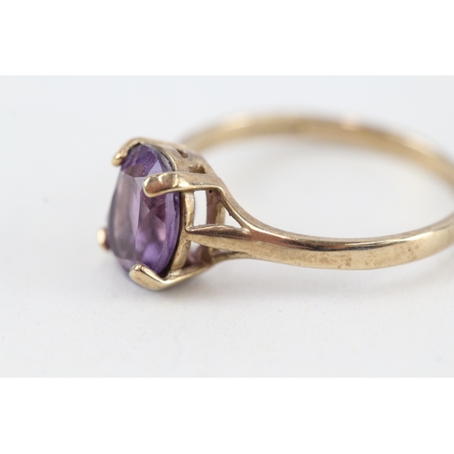 228 - 9ct gold pruple gemstone ring (2g)