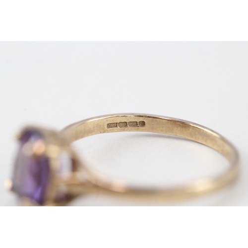 228 - 9ct gold pruple gemstone ring (2g)