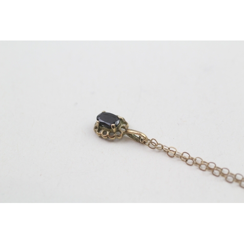 245 - 9ct gold sapphire pendant necklace (0.8g)