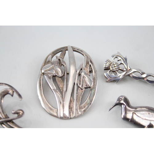 318 - Four silver Scottish/Celtic brooches including Ola Gorie & Malcolm Gray (23g)