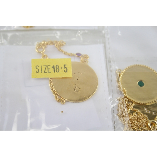 324 - A collection of gold tone silver zodiac necklaces (94g)