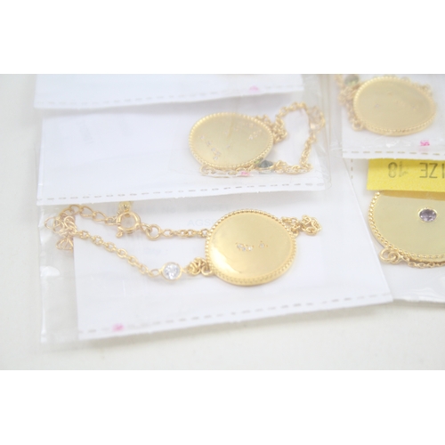 325 - A collection of gold tone silver zodiac necklaces (79g)