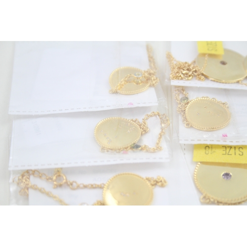 325 - A collection of gold tone silver zodiac necklaces (79g)