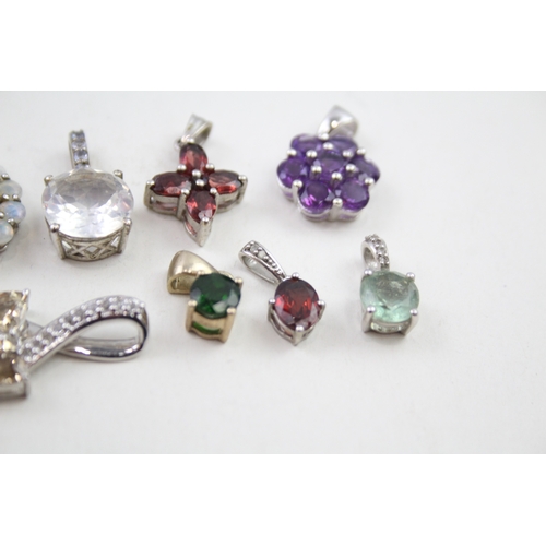 329 - A collection of silver TGGC gemstone pendants including Opal (21g)