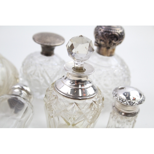 49 - 7 x .925 sterling banded / topped & cut glass ladies vanity scent bottles