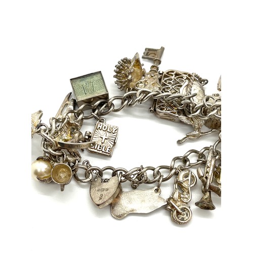 611 - Silver charm bracelet, 70 grams