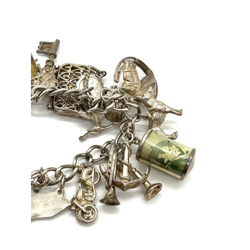 611 - Silver charm bracelet, 70 grams