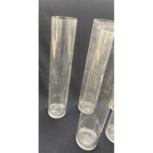 18 - Five tall glass vases overall height 20 inches tall