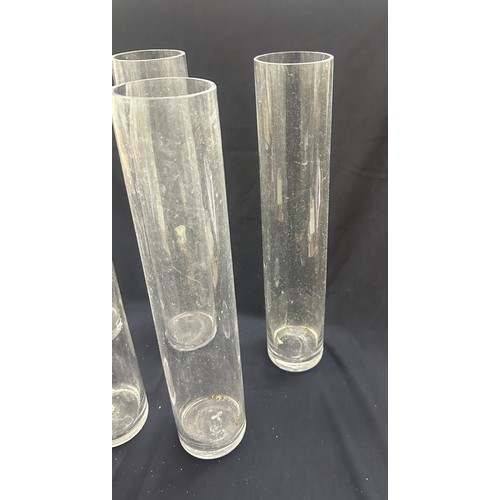 18 - Five tall glass vases overall height 20 inches tall