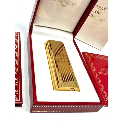 459 - Original boxed Cartier cigarette lighter in as new condition complete with boxes and booklet