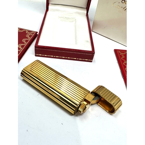 459 - Original boxed Cartier cigarette lighter in as new condition complete with boxes and booklet