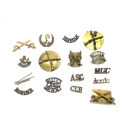 593 - Box of trade badges and shoulder tiles