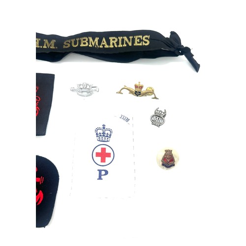 599A - Selection of Navy and submarine badges