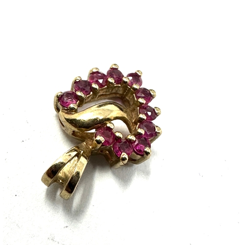 180 - 9ct gold ruby heart pendant