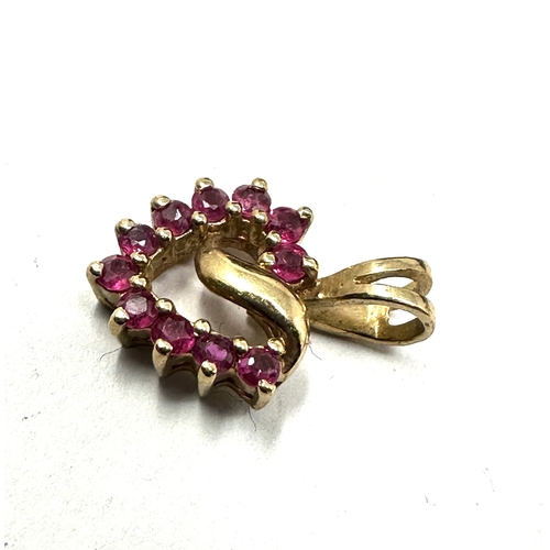 180 - 9ct gold ruby heart pendant