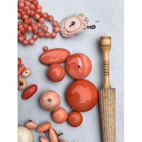 193 - Assorted antique coral beads buttons etc weight 75g also includes bone umbrella needle case