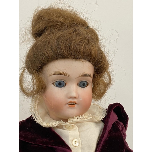 458 - Antique bisque head doll composition body makers mark to back of head height 43cm