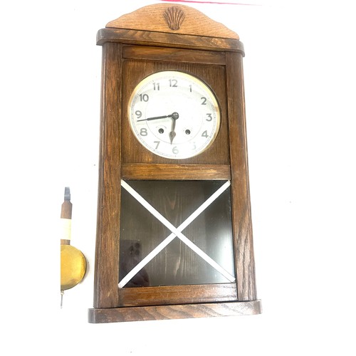 263 - Two wooden wall hanging clocks both as found and untested - largest measures approx 22 inches tall b... 