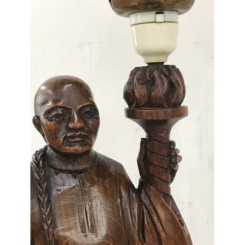 252 - Pair of carved wooden lamps of with glass flame lamp shades, height approximately 25 inches