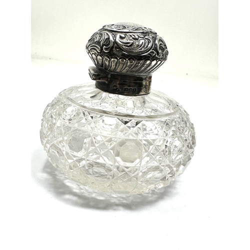 13 - Antique silver & cut glass perfume bottle measures approx height 9cm by 9cm dia London silver hallma... 